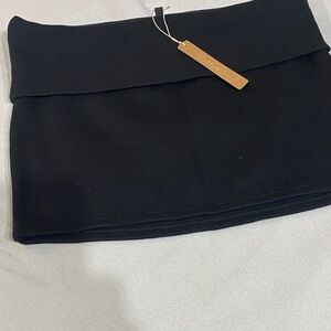 SkimsBlack fold over skirt with Tan Tag